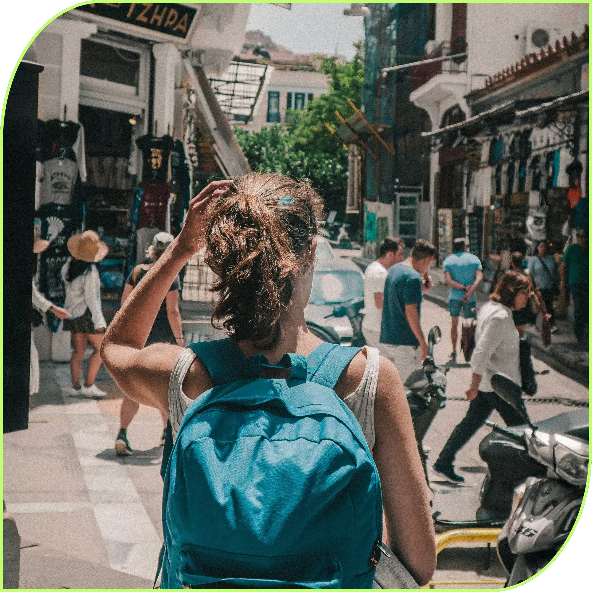 2B LOCAL app: Person wearing a blue backpack adjusts hair while walking in a busy outdoor market street.